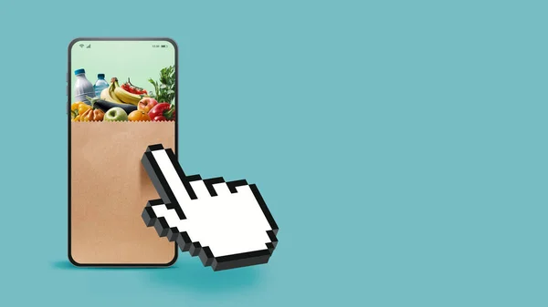 手のカーソルは食料品袋とスマートフォンをクリックして オンライン食料品のショッピングコンセプト — ストック写真