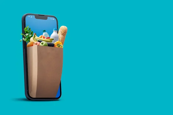 Online Einkauf Und Hauszustellung Tüte Voller Lebensmittel Kommt Vom Smartphone — Stockfoto