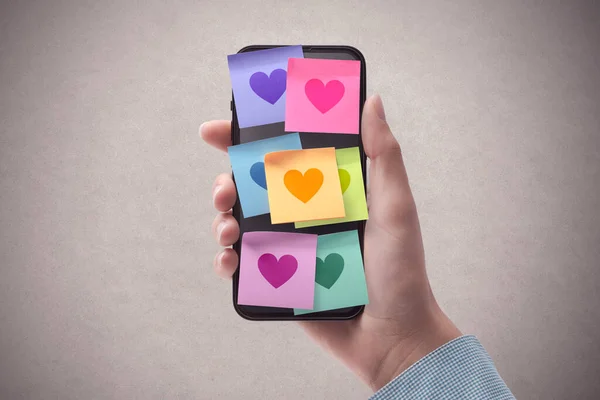 Woman Holding Smartphone Lots Sticky Notes Hearts Display Relationships Communication — Stock Photo, Image