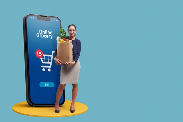 Happy Woman Holding Full Grocery Bag Smartphone Online Grocery Shopping — Stok Foto