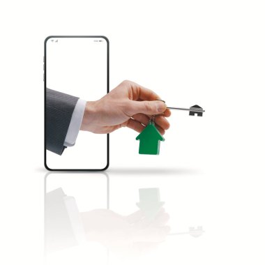 Real estate agent hand in a smartphone screen holding your new house keys, real estate app concept, copy space