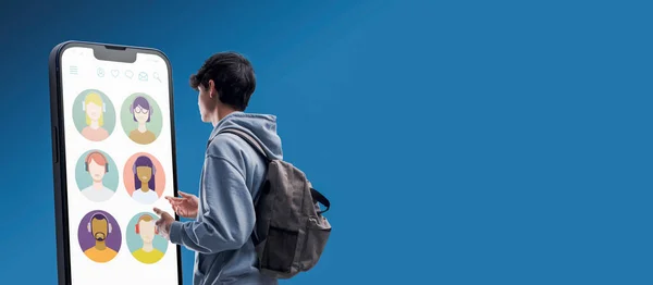 Teenager Interacting Social Media Apps Big Smartphone Technology Communication Concept — Zdjęcie stockowe