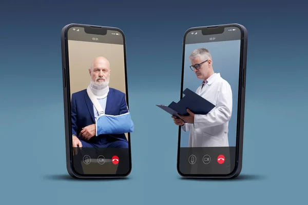 Online doctor taking care of a patient with broken arm on video call, telemedicine concept