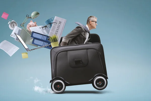 Businessman Riding Fast Briefcase Wheels Losing His Office Equipment Business — Stock Photo, Image