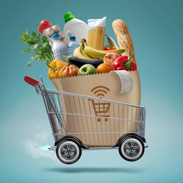 高速ターボショッピングカートは 食料品を提供します オンライン食料品のショッピングとエクスプレス配信コンセプト — ストック写真