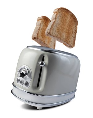 Eski tost makinesinden fırlayan kızarmış ekmek. Beyaz bir grupta..