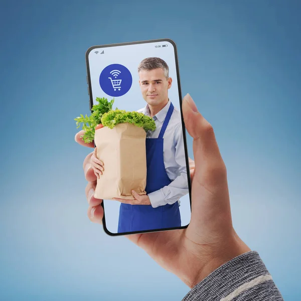 Online Grocery Shopping App Shop Assistant Holding Full Grocery Bag — Zdjęcie stockowe