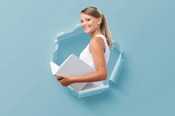 Happy Young Female Student Coming Out Torn Paper Hole Holding — Stock Photo, Image