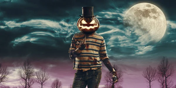 Creepy horror Halloween pumpkin head monster smiling surrounded by fog, copy space
