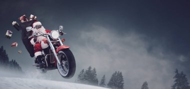 Unconventional Santa Claus riding a fast motorcycle on the snow and delivering Christmas gifts clipart