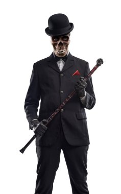 Horror elegant Halloween character with skull head posing and looking at camera, he is wearing a suit and bowler hat clipart