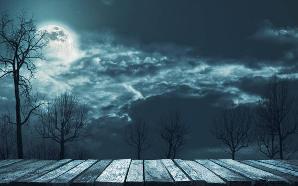 Old rough wooden pier at the lake and moonlit misty spooky forest at night: horror background