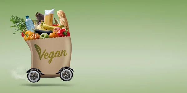 Automated grocery bag on wheels carrying vegan healthy food, online grocery shopping and delivery concept