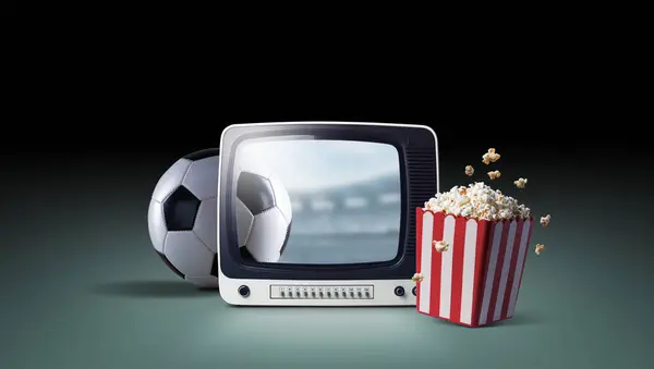 Vintage television, soccer ball and popcorn: watch soccer championships and sports at home