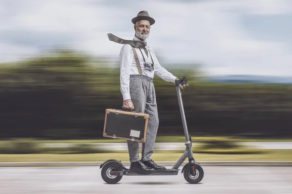 Vintage Style Smiling Traveler Riding Electric Scooter Carrying Luggage City — Stock Photo, Image