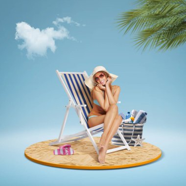 Happy smiling tourist relaxing on a deckchair and sunbathing on the tropical beach