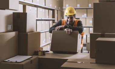 Happy warehouse worker smiling and looking at camera, logistics and delivery service concept clipart