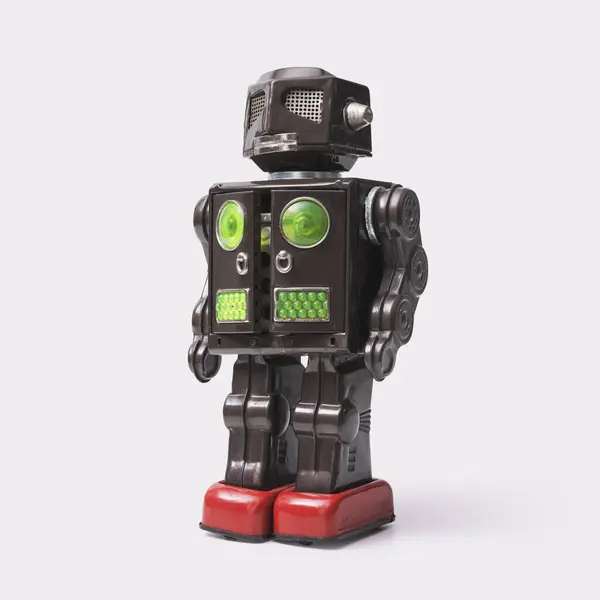 Stock image Funny vintage tin toy robot on white background, wind-up toys and collectibles concept