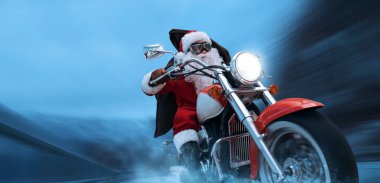 Unconventional biker Santa Claus riding a fast motorbike and delivering Christmas gifts clipart