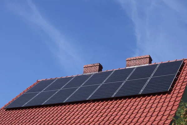 Details of a classic family home roof with solar panels.