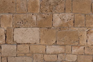 Dokulu Kum Taşı Duvarı. Duvardaki yıpranmış kumtaşı bloklarına yakın çekim