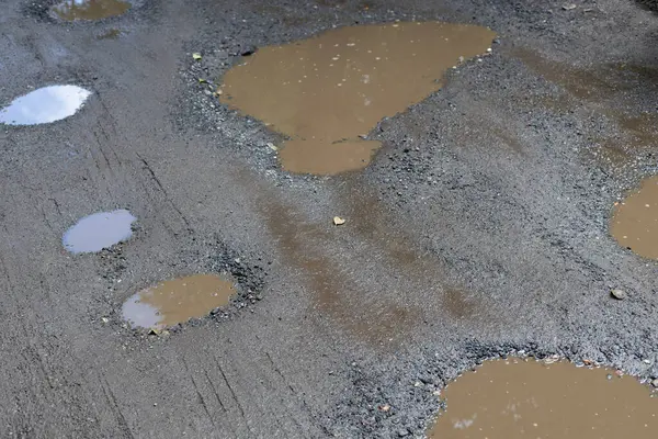 stock image Puddles on Muddy Road Surface