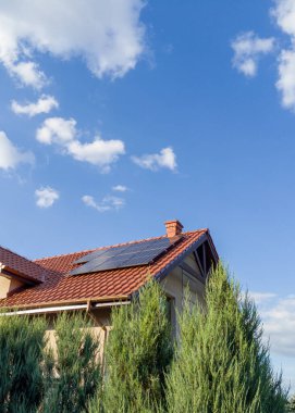 House with Solar Panels and Blue Sky clipart