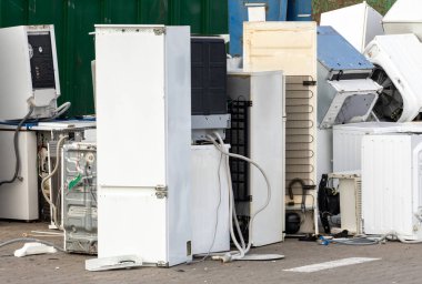 Old refrigerators and washing machines for e-waste disposal clipart