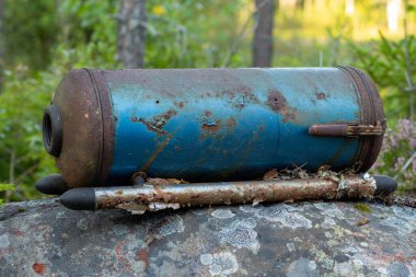 Old vacuum cleaner found in forest highlighting e-waste issues clipart