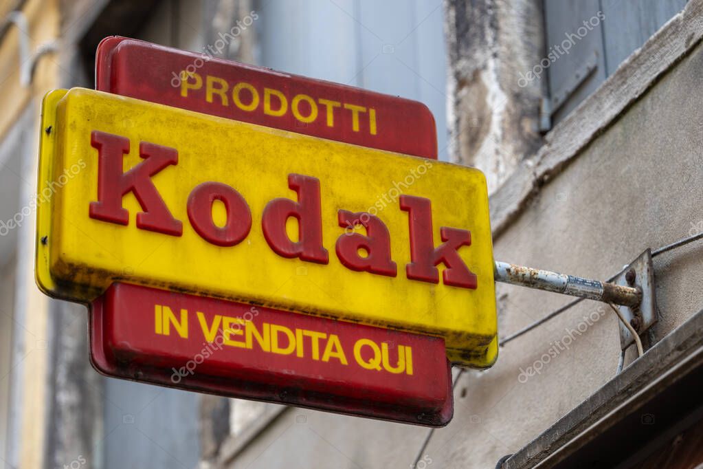 Venice, Italy - April 20 2025: Vintage Kodak sign on exterior wall of old shop in historic Venice district