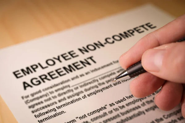 Man Signing Employee Non Compete Agreement Selective Focus —  Fotos de Stock