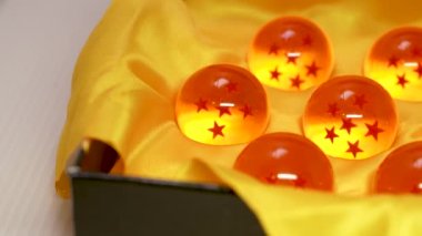 Set of seven orange crystal dragon ball with stars. Selective focus. Macro shot