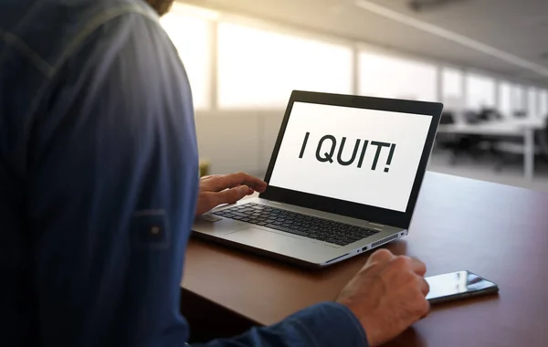 stock image Worker in an office with the message I quit on screen. Business Quiet quitting concept or burnout