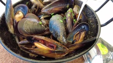 Steamed Mussels with Wine and Cilantro, a typical mediterranean fishermen recipe.