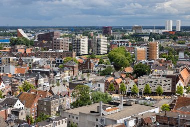 Skyline with aerial view rooftops and modern buildings residential area downtown Dutch medieval city Groningen