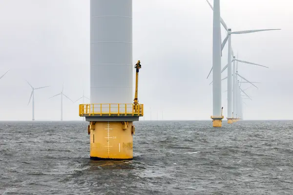 stock image Offshore windfarm near Dutch coast with cloudy sky. This park in the lake IJssselmeer near Urk is the biggest windfarm of the Netherlands