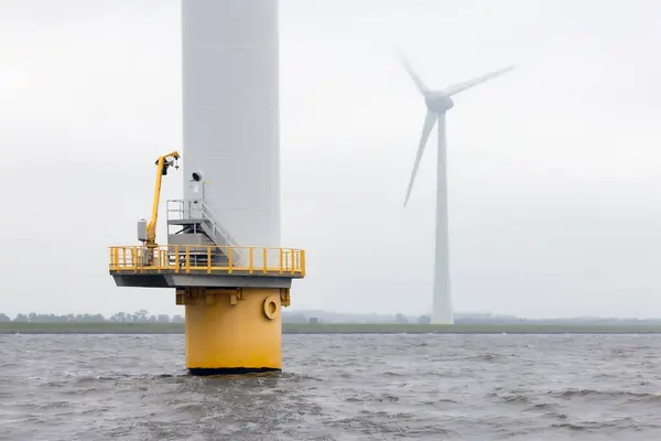 stock image Offshore windfarm near Dutch coast with cloudy sky. This park in the lake IJssselmeer near Urk is the biggest windfarm of the Netherlands