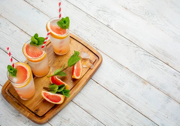 Three Glasses Drink Slices Fresh Grapefruit Wooden Background Creative Minimal Лицензионные Стоковые Фото