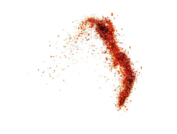 Isolated pepper splashes on a white background. Explosion. Chile. Paprika. Spice. Hot pepper powder. Taste of pepper. Mexican. Element for the design. Flying powder