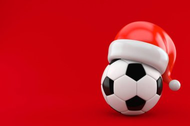 Kırmızı arka planda izole edilmiş Noel Baba şapkalı futbol topu. 3d illüstrasyon