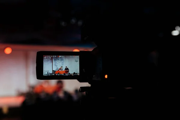 video recording of a concert, video camera, event, video recording