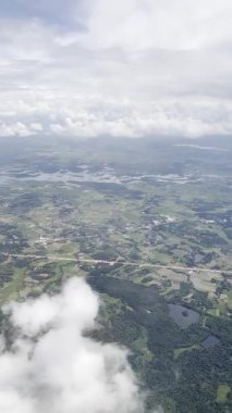 footage from an airplane window. Scenic view over beautiful white clouds and sky. Concept of freedom, travel, journey and transportation.