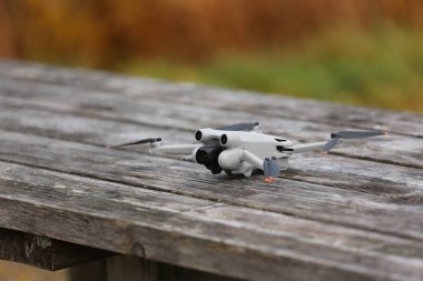 DJI Mavic mini hovering mid air with bokeh background