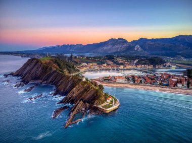 Aerial view of Ribadesella and its estuary at sunset in Asturias, Spain. clipart