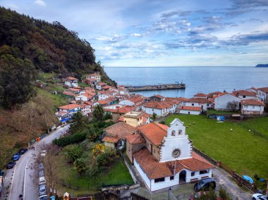 Aerial view of the fishing village of Tazones in Asturias, Spain. Europe. clipart