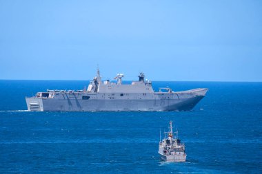 Aircraft carrier L-61 Juan Carlos I  and Tambre M33 minehunting ship of the Spanish Navy in the bay of Gijon, Asturias clipart