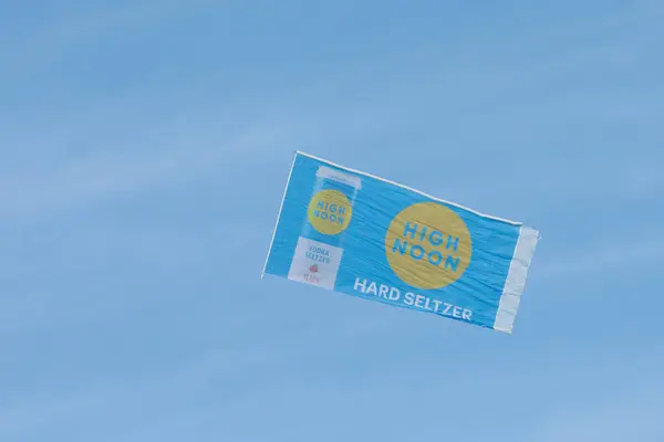 stock image South Amboy, New Jersey - July 3, 2024: an airplane pulls a High Noon Hard Seltzer banner along the Jersey Shore