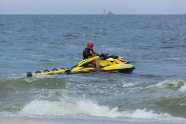 Sea Bright, New Jersey - August 3, 2017: Lifeguards from Sea Bright and surrounding beach clubs gather to compete in a lifeguard competition clipart