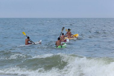 Sea Bright, New Jersey - August 3, 2017: Lifeguards from Sea Bright and surrounding beach clubs gather to compete in a lifeguard competition clipart