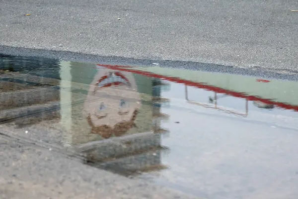 stock image Asbury Park, New Jersey - July 29, 2024: The Wonder Bar sign, with Tillie, is reflected in a puddle on the street after a rain storm